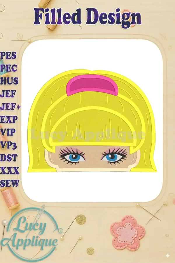 A close-up of a filled Barbie face embroidery design. The design is predominantly yellow, with pink accents and blue eyes. The image showcases the design's detail and stitch quality.