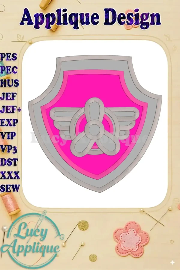 Embroidery design of Skye's Paw Patrol insignia; a pink shield with wings and propeller, ready to be stitched. High-quality applique design.