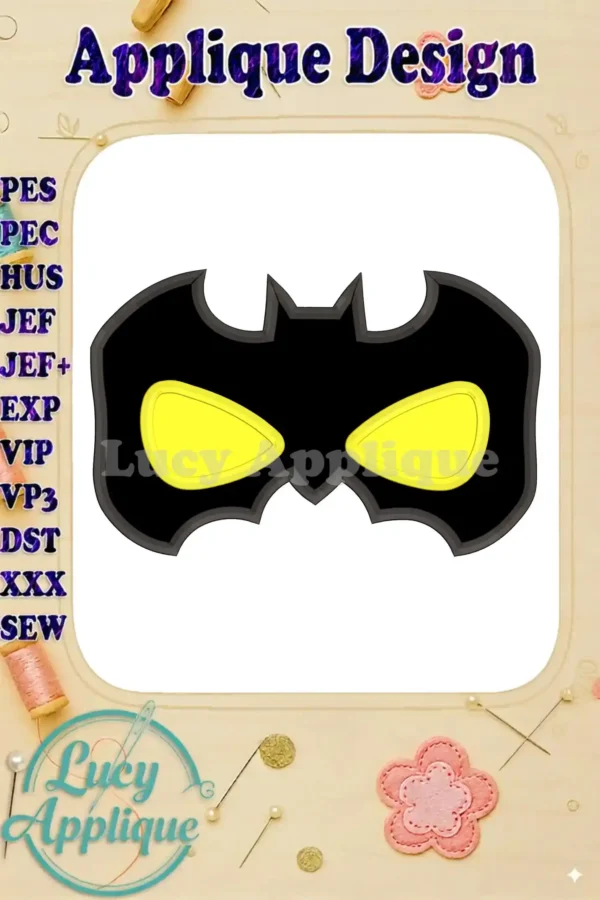 A detailed close-up of the Batman mask applique embroidery design. The design showcases the iconic Batman mask with yellow eyes, ready to be stitched.