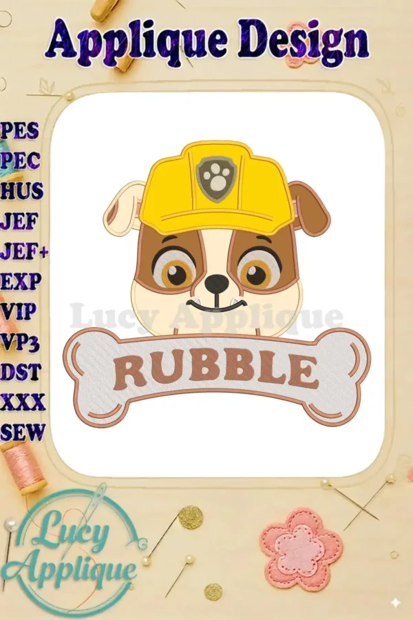 A close-up of Rubble from Paw Patrol, wearing his yellow construction helmet, with a bone applique banner featuring his name.